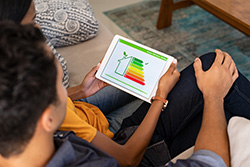 Couple looking at home's energy report on a tablet
