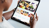 Person browsing website on a tablet